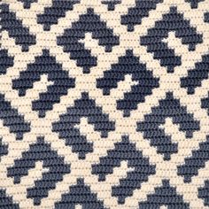 a blue and white knitted area rug