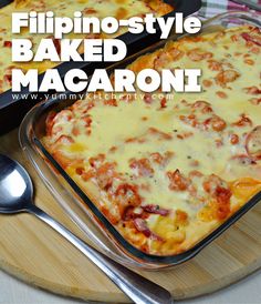 two pans filled with baked macaroni sitting on top of a cutting board