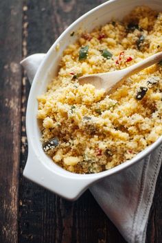 a casserole dish with a wooden spoon in it