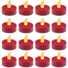 twelve red candles with yellow flame on each one are arranged in the shape of a circle