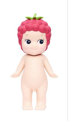 a small doll with red hair and blue eyes is standing in front of a white background