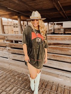 Our Dixie Wild Mineral Wash Black Stay Wild Concert Tee/Dresses are wider and oversized for the ultimate country concert outfit!Pair it with one of our custom hats, statement necklaces, and knee high Lucchese's for a neck breaking outfit.Black midnight super soft vintage mineral stone wash tee. Made with 100% USA grown cotton. Pre-Shrunk and 100% sourced and created in the land of the free, USA baby.We highly recommend wearing shorts underneath, because, well, you're prob gonna be dancing outsid Dress For A Country Concert, Food Truck Festival Outfit, Bun B Concert Outfit, Country Rock Concert Outfit Plus Size, Duelo Concert Outfit, Oversized Tshirt Dress Outfit Western, T Shirt Dress With Cowgirl Boots, Cute Nashville Outfits Summer Going Out, Plus Size Summer Country Concert Outfit