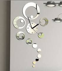 a clock that is on the side of a wall with circles and lights around it