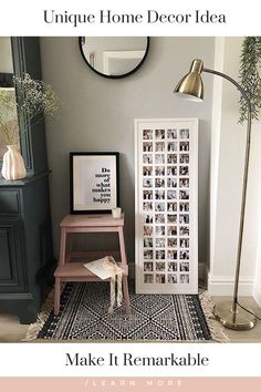 a living room with a chair, table and pictures on the wall next to it