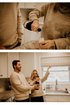 two people are standing in the kitchen and one is pouring something into a cup while the other holds a bottle