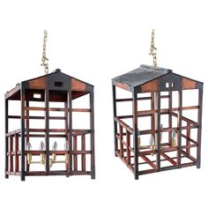 two wooden lanterns with bells hanging from them