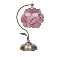 a table lamp with pink and white glass petals on it's arm, against a white background