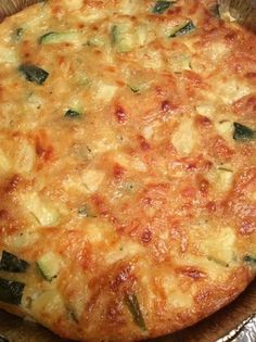 a casserole dish with cheese and spinach on it's side, ready to be eaten