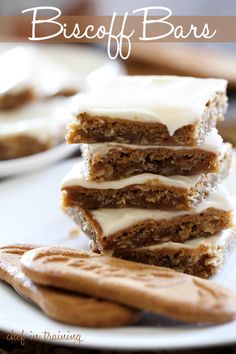 a stack of dessert bars sitting on top of a white plate