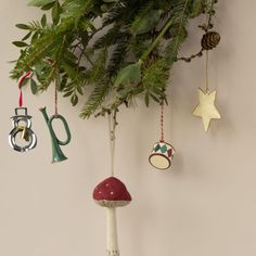 christmas ornaments hanging from a tree branch