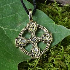 This intriguing Celtic cross pendant radiates a sense of strength and purpose. Do you feel it? Wherever you are in your spiritual journey, this amazing piece of jewelry will touch your soul, and instill a feeling of comfort and calm. For many, the four equal arms of the cross represent the four corners of the earth, and the encompassing circle is seen either as a symbol of eternity, or as a ring of shelter and protection. Is this an example of a solar cross? There are certainly many parallels be Solar Cross, Pagan Cross Stitch, Celtic Cross Stitch, Dragon Cross Stitch, Leather Bound Journal, Witchy Jewelry, Bronze Jewelry, Dragon Jewelry, Personal Statement