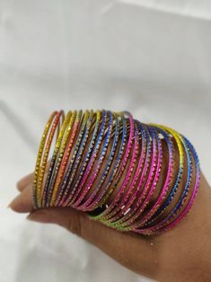 Welcome to our shop We bring to you very ethnic products from core of India almost every thing is handmade or custom made Set of 22 Bangles in multiple colors Size 2.4 We will be happy to serve you Multicolor Festival Bangle Jewelry, Multicolor Festival Bangle Bracelet, Bohemian Stackable Bangle For Party, Stackable Bohemian Bangle For Party, Multicolor Bangle Bracelets For Festival, Multicolor Stackable Bangle Jewelry, Bohemian Multicolor Bangle For Gift, Bohemian Multicolor Bangle As Gift, Bohemian Multicolor Round Bangle