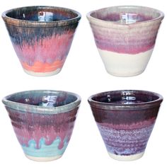 four bowls with different colors and designs on them