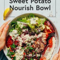 two hands holding a bowl of food with the words sweet potato nourish bowl