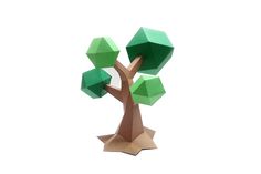 an origami tree with green leaves on white background