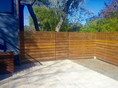 a wooden fence in front of a house