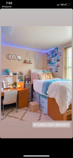 a bed room with a neatly made bed next to a desk and chair in front of a window