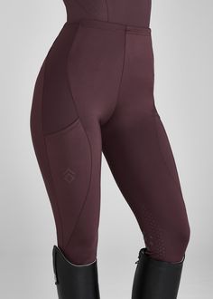 the leggings are made from high - waisted fabric and have black rubber boots