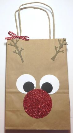 a brown paper bag with reindeer's nose on it