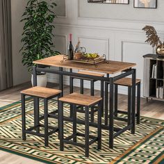 a dining table with four stools in front of it