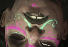 a close up of a person's face with neon paint on it