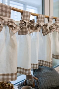 the kitchen curtains are hanging from the rod and ready to be hung on the window sill