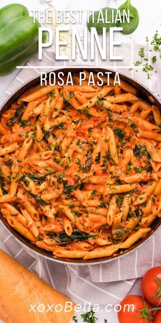 the best italian penne rosa pasta with tomatoes and parsley in a pan