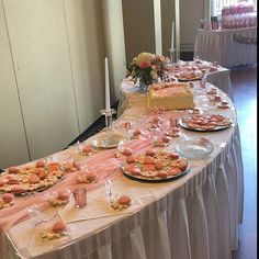 a table topped with lots of food and desserts