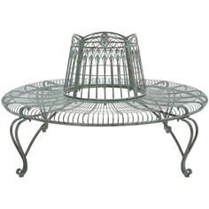 a metal birdcage sitting on top of a table