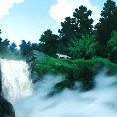 a man standing in front of a waterfall