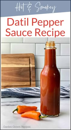 a bottle filled with hot sauce next to two carrots on a counter and the words, how to smokey dati pepper sauce recipe