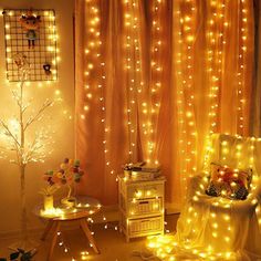 a living room filled with lots of lights next to a window covered in sheer curtains