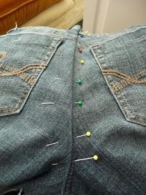 the jeans are being sewn together with pins