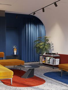 a living room filled with furniture and a blue curtain