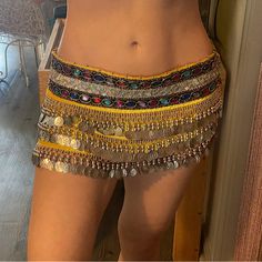 Yellow Belly Dancer Skirt Could Fit Sizes Xs, Small & Medium Depending On What You Wear Under It & How You Like It To Fit You See Pictures For Measurements I’m A Size Small, See How It Fits Me Could Definitely Fit Someone Bigger You Will Probably Have To Wear Something Under It It Ties In The Side Would Be A Good Halloween Party Costume I Have Matching Belly Dancer Tops In My Closet Sold Separate ~Feel Free To Bundle Them~ Not Perfect, See Pictures For Flaws Never Wore Outside My House Extremely Belly Dancer Halloween Costume, Belly Dancer Halloween, Belly Dancing Skirt, Belly Dancer Costume, Belly Dancer Costumes, Blue Striped Skirt, Cute Group Halloween Costumes, Halloween Party Costume, Velvet Mini Skirt