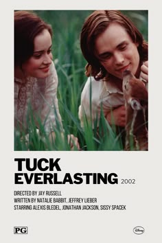 the poster for tuck everlasting with two people and a dog in tall grass