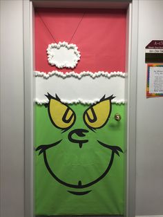 a door decorated to look like the grinch from how the grinch stole christmas