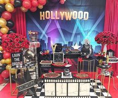 a hollywood themed party with balloons and decorations