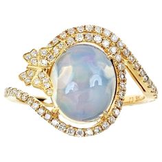 Stunning, timeless and classy eternity Unique Ring. Decorate yourself in luxury with this Gin & Grace Ring. The 14K Yellow Gold jewelry boasts with Oval-cab Ethiopian Opal (1 pcs) 0.49 carat and Natural Round-cut white Diamond (70 Pcs) 0.36 Carat accent stones for a lovely design. This Ring is weight 3.08 grams. Crafted with 14K Yellow Gold, this delicate Ring is polished to a high finish shine. Yellow Gold Cocktail Ring, Ethiopian Opal Ring, Hot Jewelry, Gold Cocktail Ring, Gold Cocktail, Yellow Gold Jewelry, Best Diamond, Delicate Rings, Natural Opal