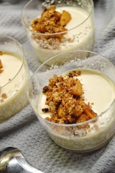 three desserts in small glass bowls on a table