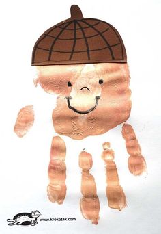 a child's handprint with an image of a bear wearing a hat