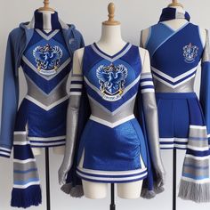 three cheer uniforms on mannequins with blue and silver colors