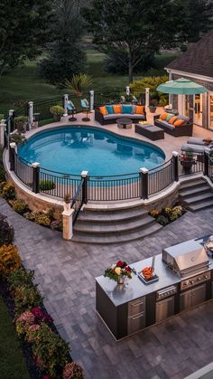 an above ground swimming pool surrounded by patio furniture and outdoor kitchen with seating area next to it