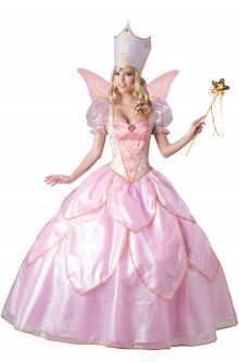 a woman in a pink fairy costume is holding a wand and wearing a tiara