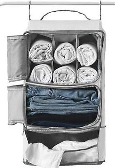 an open suitcase filled with folded clothes