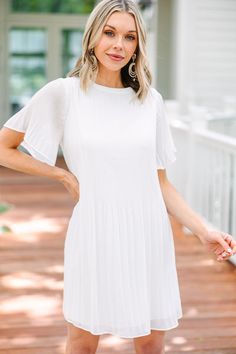 Look chic and feel comfortable with this white pleated dress. Its crisp color and pleated detailing add an elegant touch to your look. The perfect choice for any special occasion! This dress features short flutter sleeves, a round neckline, and pleated detailing.  Material has no amount of stretch.Cam is wearing the small. White Pleated Dress, Bride Clothes, Work Attire