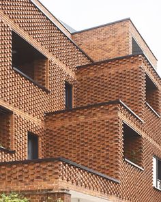 a building made out of bricks and windows