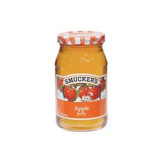 a jar of apple jelly on a white background