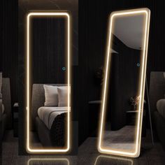 two mirrors with lights in the shape of rectangles, one reflecting a bed