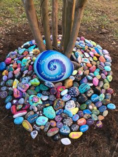 there is a tree that has been made out of rocks and stones in the shape of a ball